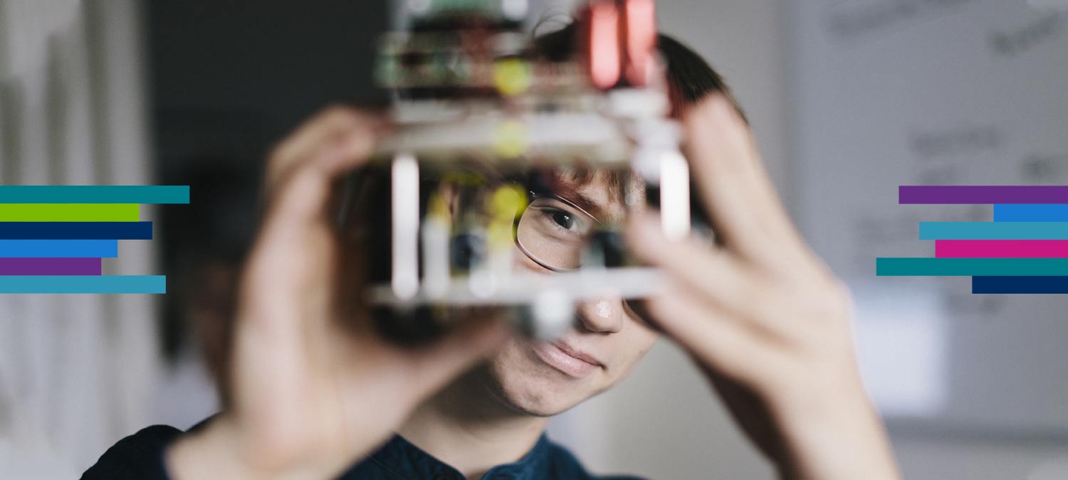 Man looking through innovative mechanical item