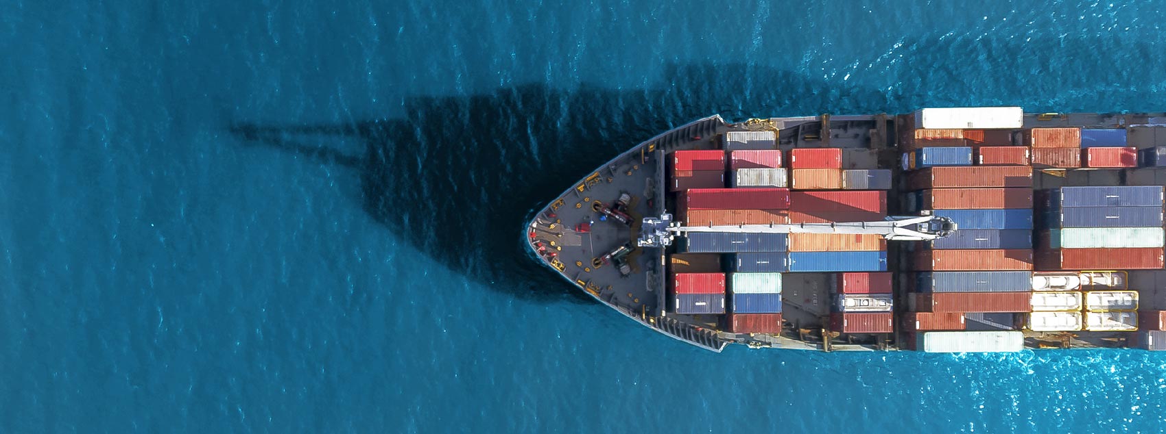 Overhead view of a ship with shipping containers 